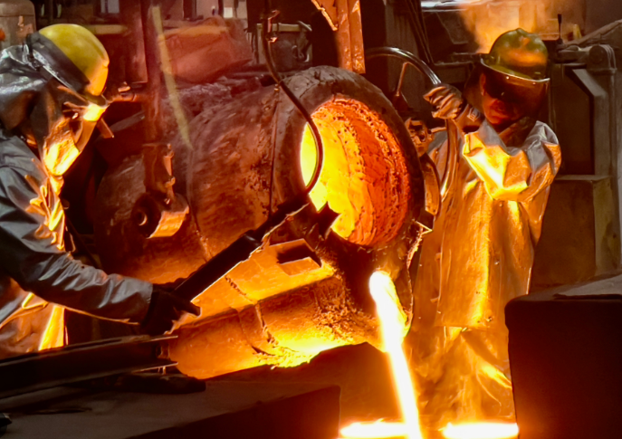 Molten metal poured into sand mold with PPE